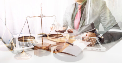 Business and lawyers discussing contract papers with brass scale on desk in office. Law, legal services, advice, justice and law concept picture with film grain effect