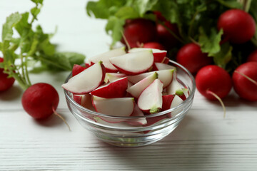 Fresh radish on white wooden background, close up