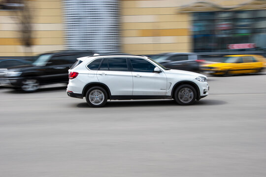 Ukraine, Kyiv - 26 April 2021: White BMW X5 car moving on the street. Editorial