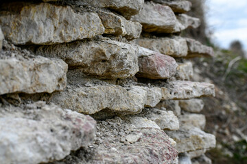 Ancient stone hay made of white stone. Roughly finished brick. 