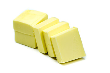 Butter chunks isolated on white background