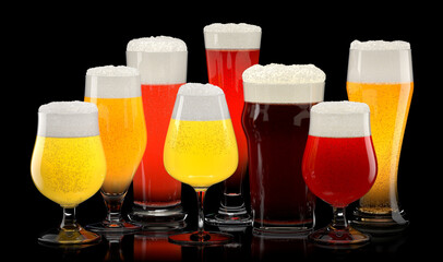 Set of fresh different beer glasses with bubble froth on black background.