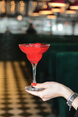 Glass refreshing rose punch with rose petals inside. Romatica St. Valentines day cocktail.