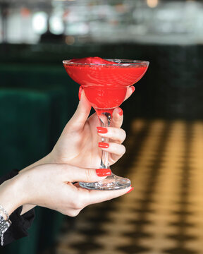 Glass refreshing rose punch with rose petals inside. Romatica St. Valentines day cocktail.