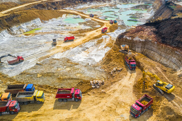 Quarry, mining and construction, excavators and trucks, view from above