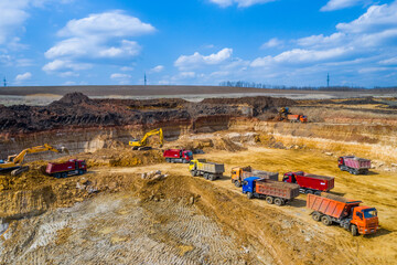 Quarry, mining and construction, excavators and trucks, view from above