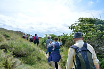 Fototapeta na wymiar Group of retired hikers at seaside in Brittany. France