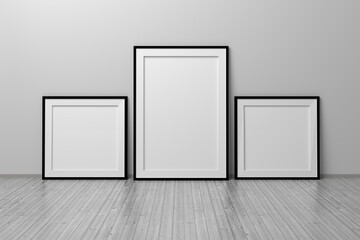 Mockup template with three frames square and A4 format standing on the floor in a room