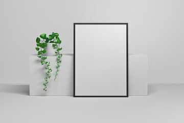 Large empty blank A4 format frame next to long geometric shape and potted plant