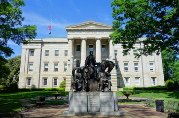 Fototapeta na wymiar The NC State Capitol building in Raleigh NC with the statue of the three US Presidents born in North Carolina
