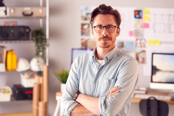 Portrait Of Serious Male Architect In Office Standing By Desk