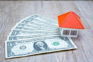 The orange roof house on the banknote Concept of real estate house in bank notes Real estate investment or home trading, text input area.