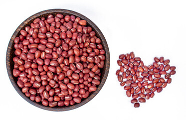 red beans in wooden bowl on white background, top view