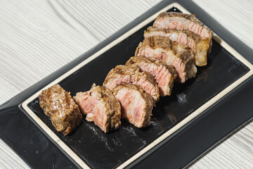 Sliced roast marbled beef. Close-up