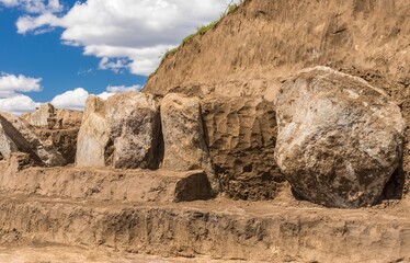 Excavations place of granite gravestone plates in ancient burial mound in Novooleksandrivka village...