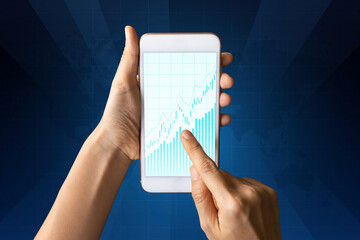 Close-up Of Business man's hand holding smartphone showing stock market statistics gain profits and increase of chart positive indicators. Financial analysis, statistics. Concept of business strategy.