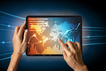 Close-up Of Business man's hand holding tablet showing stock market statistics gain profits and increase of chart positive indicators. Financial analysis, statistics. Concept of business strategy.