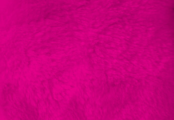 Pink fur background close up view.