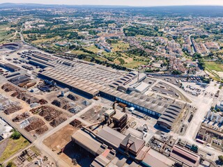 Aerial view of a giant quarry and construction site at Ecometais, a Treatment and recycling plant in Aldeia de Paio Pires industrial area, Setubal, Portugal.