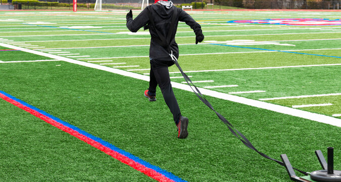 Runner dragging a sled with wieght added