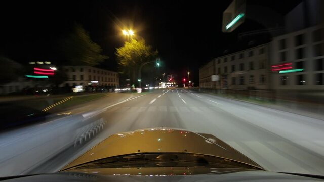 Extraordinary time lapse shot with long exposure from a car ride through St. Pauli in Hamburg