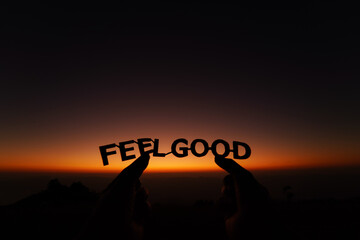 Feel good paper cut text with background sunrise sky.   