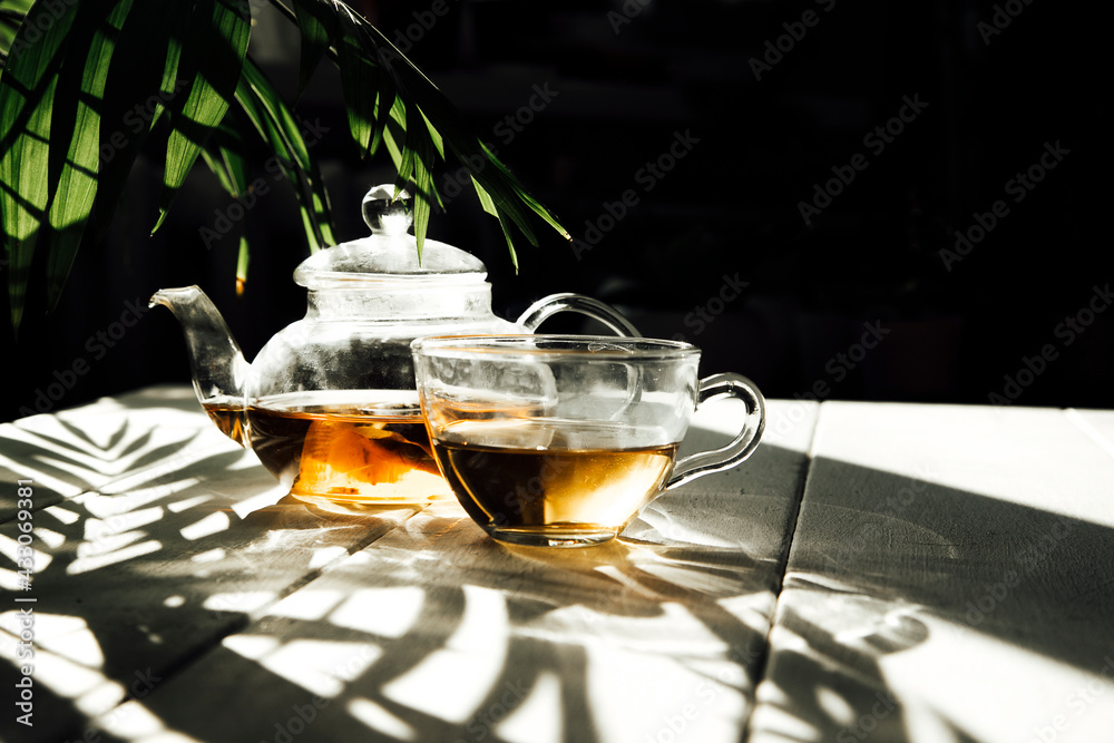 Wall mural tea in a teapot in the sun