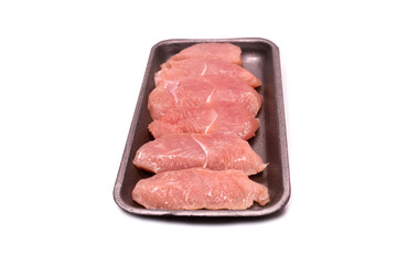 Turkey fillet in a black plastic container isolated.