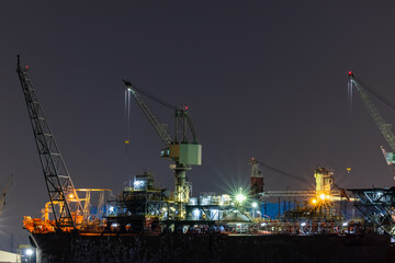 Ship Maintenance in Dry Dock at Night