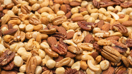 Mix of nuts isolated on white background. Top view.