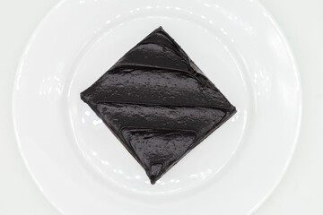 Dark Chocolate Fudge Brownie on a White Plate
