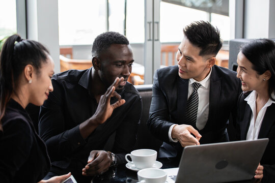Diversity businesspeople having business meeting. Black colleague discuss and explain project to team parter. corporate people working and brainstorming together.