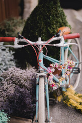 Bicycle decorated with flowers in a garden