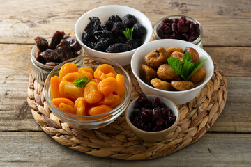 Dried fruits mix in bowls, healthy snack, sweet fruits, vegan food