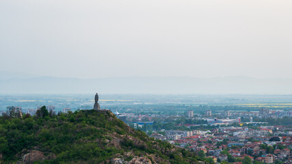 Statue overlooking a view of the city