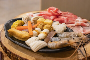 Ingredients of Shabu were arranged in a black plate