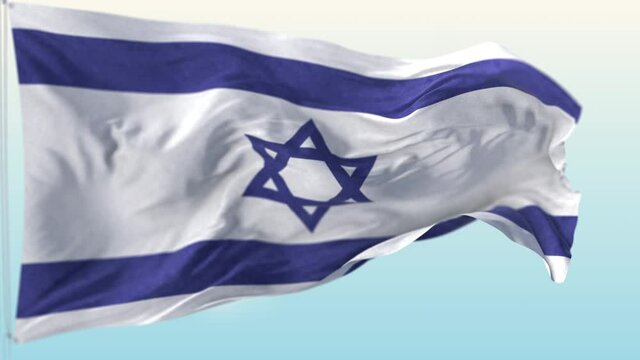 The national flag of israel blowing in the wind against a blue sky
