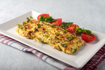 Fresh French omelet with fresh vegetables. Vegetarian food