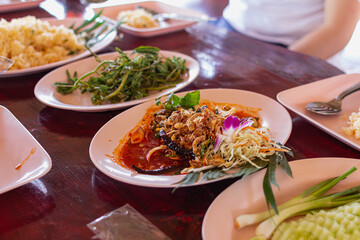 Oyster salad in a dish with vegetables and seasonings