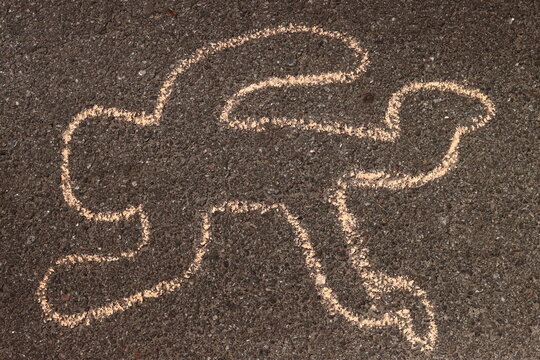 Crime scene chalk outline of a dead body