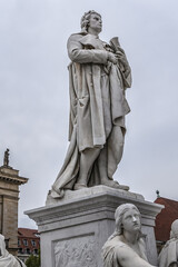 Obraz premium Monument of Germany's poet, philosopher and historian Friedrich Schiller (1871) near Concert Hall on Gendarmenmarkt Square in Berlin, Germany.