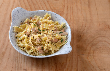 Mafalde pasta with tuna and parsley. Copy space.