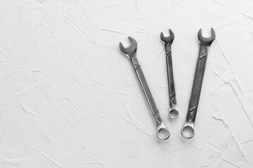 Steel spanners of different sizes and diameters. Set of chrome vanadium wrenches. Metallic repair tool for car, plumbing, machines. Copy space.