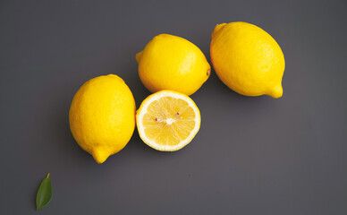 Lemon with yellow peel put on background