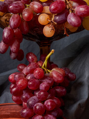 Still life of fresh fruit with pomegranate, grapes, pears and plums