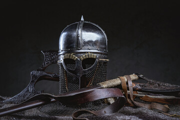 Studio shot of knight helmet around axe and fur - obrazy, fototapety, plakaty