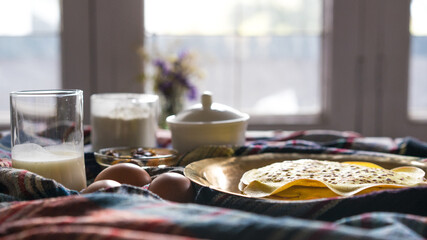 breakfast in the kitchen, pancakes with jam, breakfast in the morning, ingredients for fresh pancakes in the morning at home.