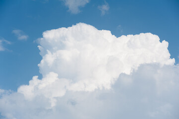 Obraz na płótnie Canvas A piece of sky with dramatic, voluminous, clouds.