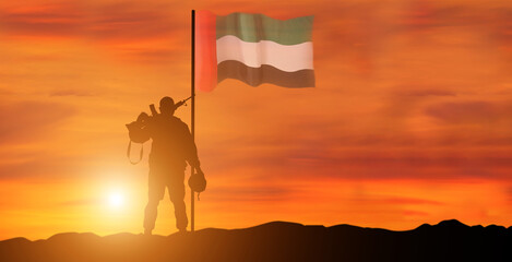 Silhouette Of A Solider Saluting Against the flag of UAE. Concept of national muslim holidays. Independence Day, Victory Day.