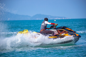 A man driving a jet ski